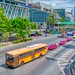 Bus and taxis on Ratchadamri road in front of Central World Shopping Mall in Bangkok, Thailand