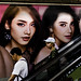 People and culture of Bangkok: Both poster and people on the escalator show Western style at    Siam Center, Thailand. 749a