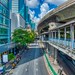 Silom road with BTS Skytrain line and Skywalk in Bangkok, Thailand