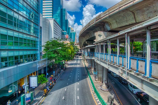 Silom road with BTS Skytrain line and Skywalk in Bangkok, Thailand