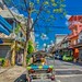 Tuk-Tuk and tree on Boripat road in Bangkok, Thailand