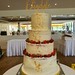 Four tiered Semi Naked Wedding Cake with soft fruits.