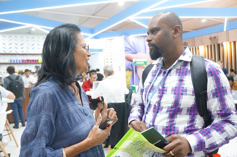 WorldFish&#039;s Shakuntala Haraksingh Thilsted speaking to an exhibition visitor at the 27th United Nations Climate Change Conference (COP27). Photo by Aniss Khalid, WorldFish.