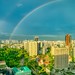 Rainbow over Singapore's city centre in the evening
