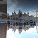 Reflecting on St Marks Square by JOHN REDDINGTON