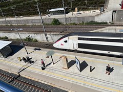 TGV inOui waits to depart from Valence TGV, southbound