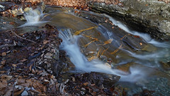 Flowing water across a rock 