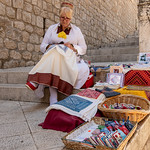 Croatian Woman At Work, Dubrovnik by John Fogarty