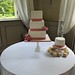 Three tiered square wedding cake with sugar roses