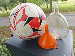 The ball, the funnel and the bottle