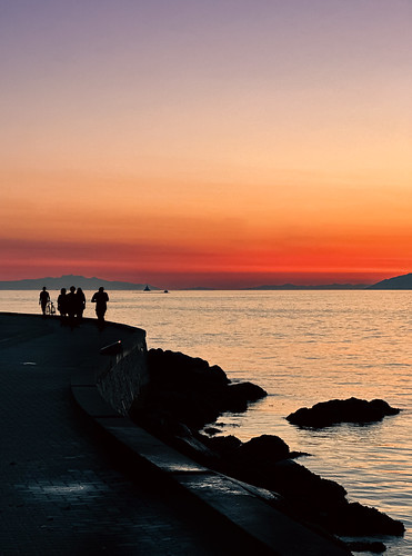Sunset silhouettes along the seawall - Vancouver, BC