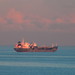 The sun starts to set on the Oil and Chemical Tanker Erika Schulte anchored up in the Firth of Forth at Kinghorn, Fife, Scotland destined for Grangemouth, Scotland on 1.12.23
