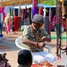 A man doing handicraft at Dilli Haat