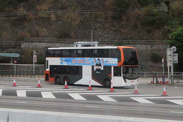 LWB double deck bus with Aviation Security Company Limited recruitment advertisement on the side at the Lantau Link Bus-Bus Interchange